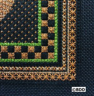 A close up of the corner of a cross stitch pattern