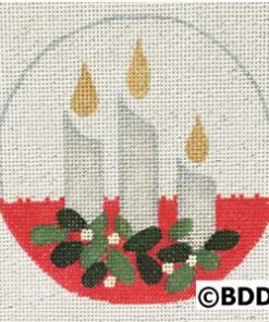 A round glass with three candles and green leaves.