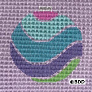 A purple background with a blue, green and pink ornament.