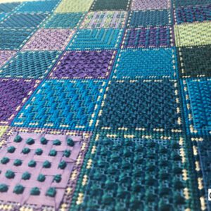 A close up of the fabric with different colors