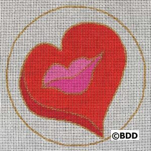 A red heart with a pink lip mark on it.