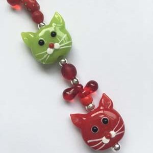 A red and green cat bead necklace.