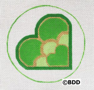 A green heart with a yellow border in the center.