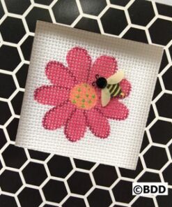 A bee on the flower of a cross stitch pattern.