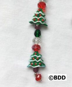 A close up of a bead with christmas trees