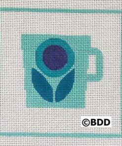 A blue coffee cup with a flower on it.