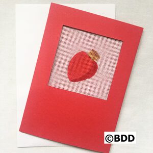 A red card with an apple on it.