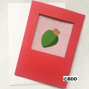 A red card with a picture of a green leaf.