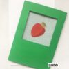 A green card with an apple on it.