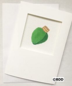 A picture of a green leaf on top of paper.