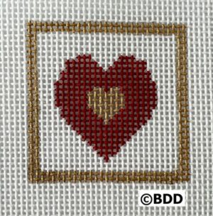 A red heart in a square frame with gold trim.