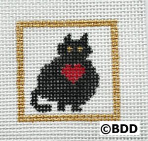 A black cat with red heart in the middle of it's frame.