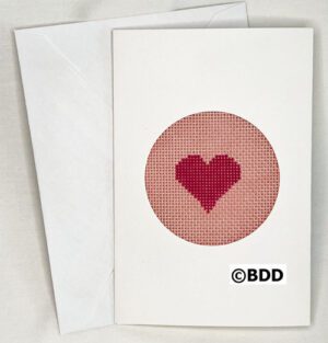 A card with a heart stitched on it.