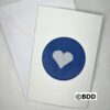 A card with a heart stitched on it.