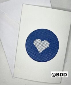 White heart on deep blue stitched circle