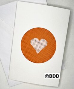 A card with an orange heart on it.