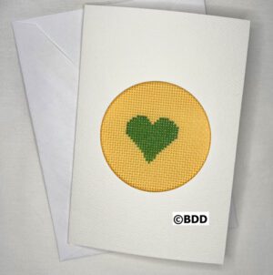 A card with a heart stitched on it.