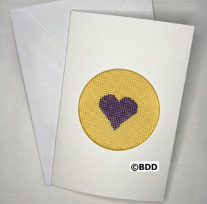 A card with a heart stitched on it.