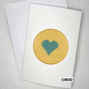 A card with a heart stitched on it.