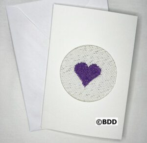 A card with a purple heart on it.