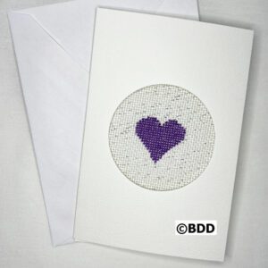 A card with a purple heart on it.