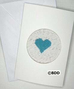 A white card with a blue heart in the middle of it.