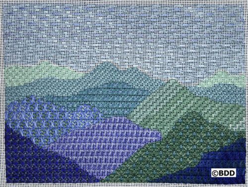 A cross stitch pattern of mountains in the distance.