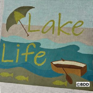 A close up of the word lake life on a blanket