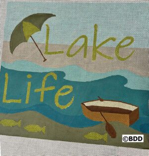 A close up of the word lake life on a blanket