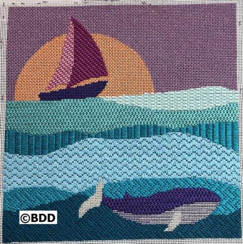 Sailboat and whales at sunset needlepoint.