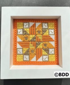 A picture of the frame that is made with cross stitch.
