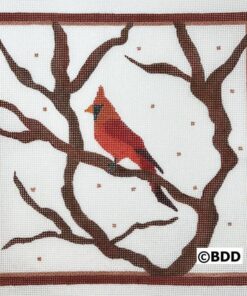 Framed needlepoint cardinal among bare branches