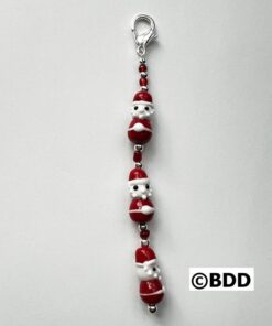 A red and white santa clause key chain.