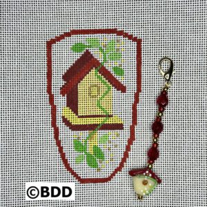 A cross stitch pattern of a bird house.