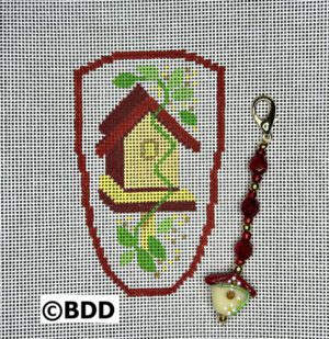 A cross stitch pattern of a bird house.