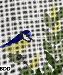 Bluebird on green leafy branch.