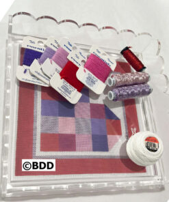 Needlepoint canvas and colorful embroidery threads